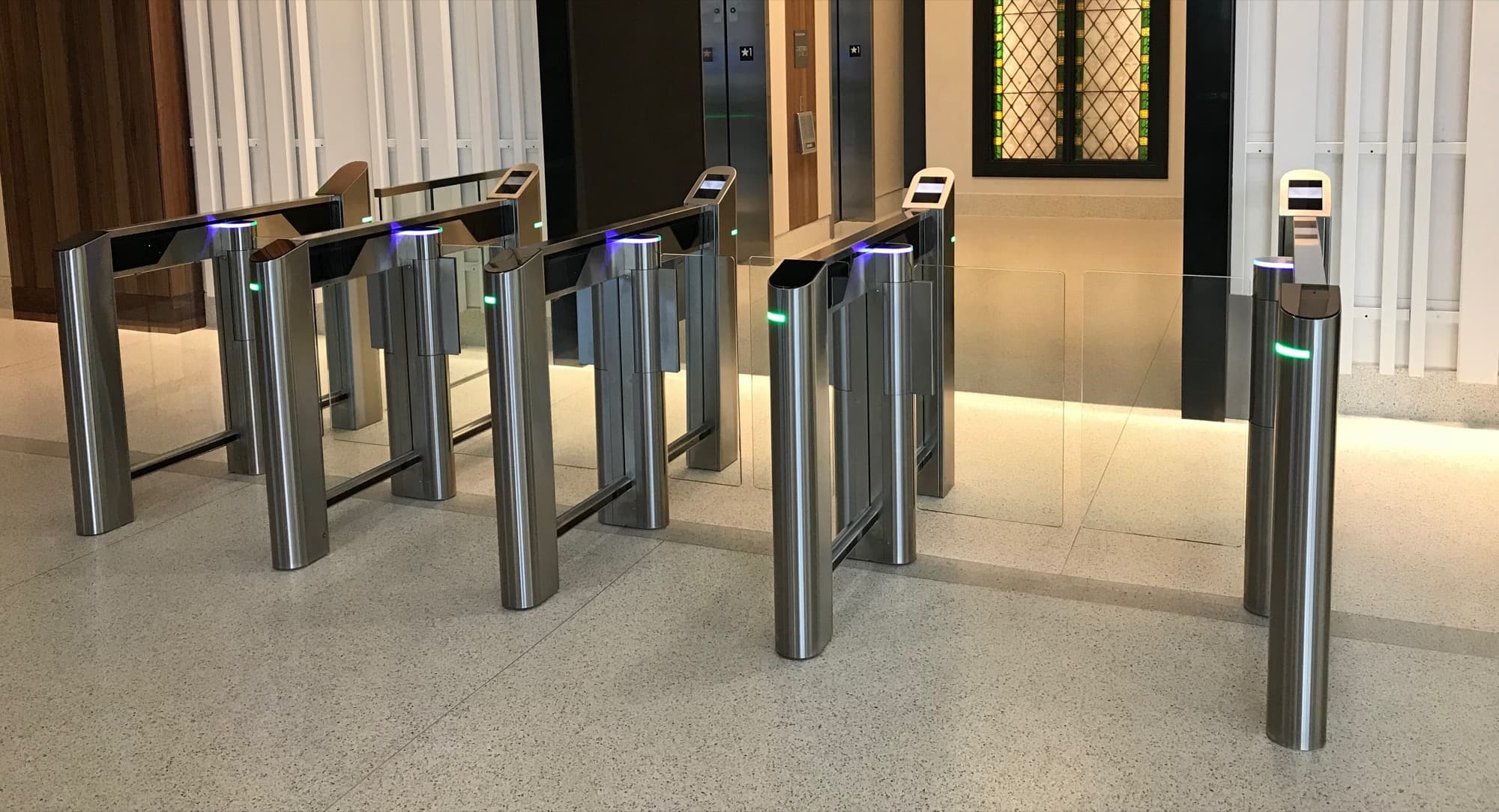 Optical speed lanes controlling entry through a building lobby