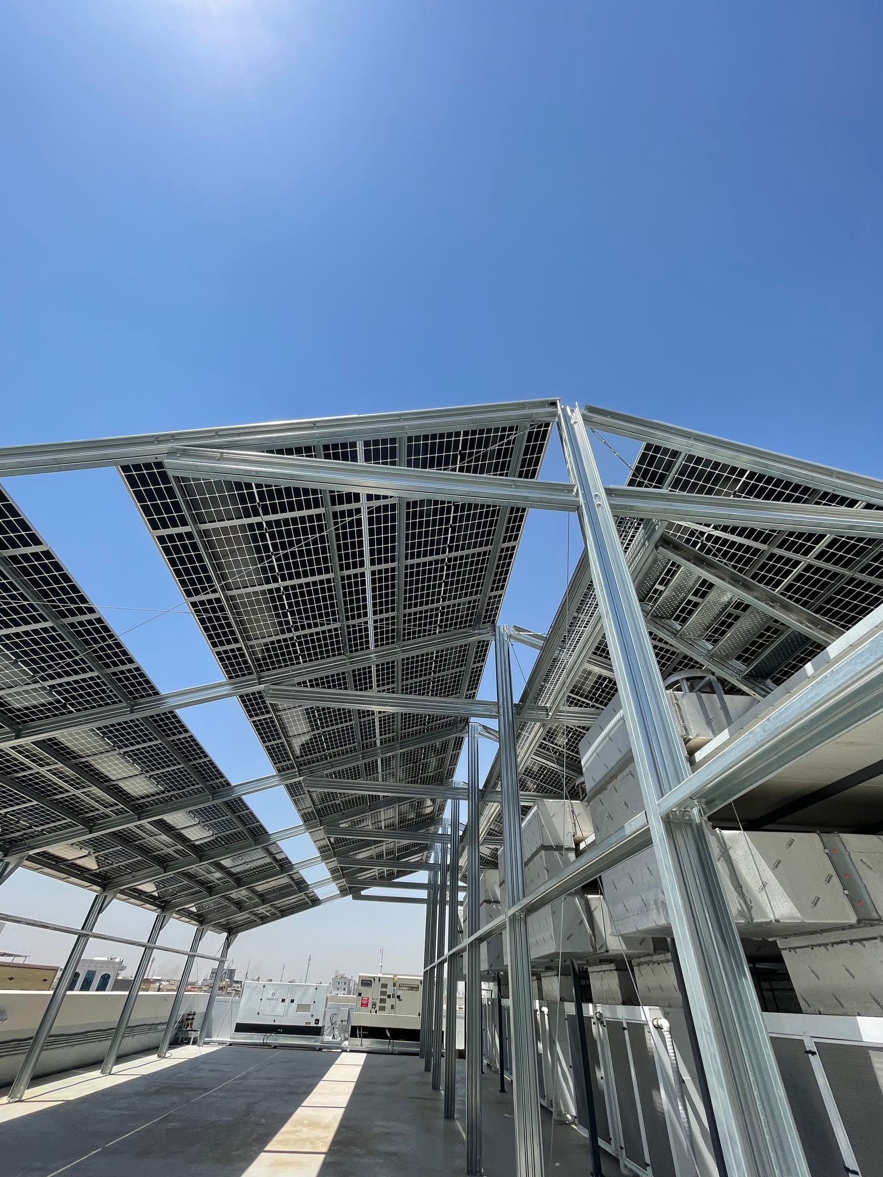 Solar panel canopy structure installed on a building rooftop