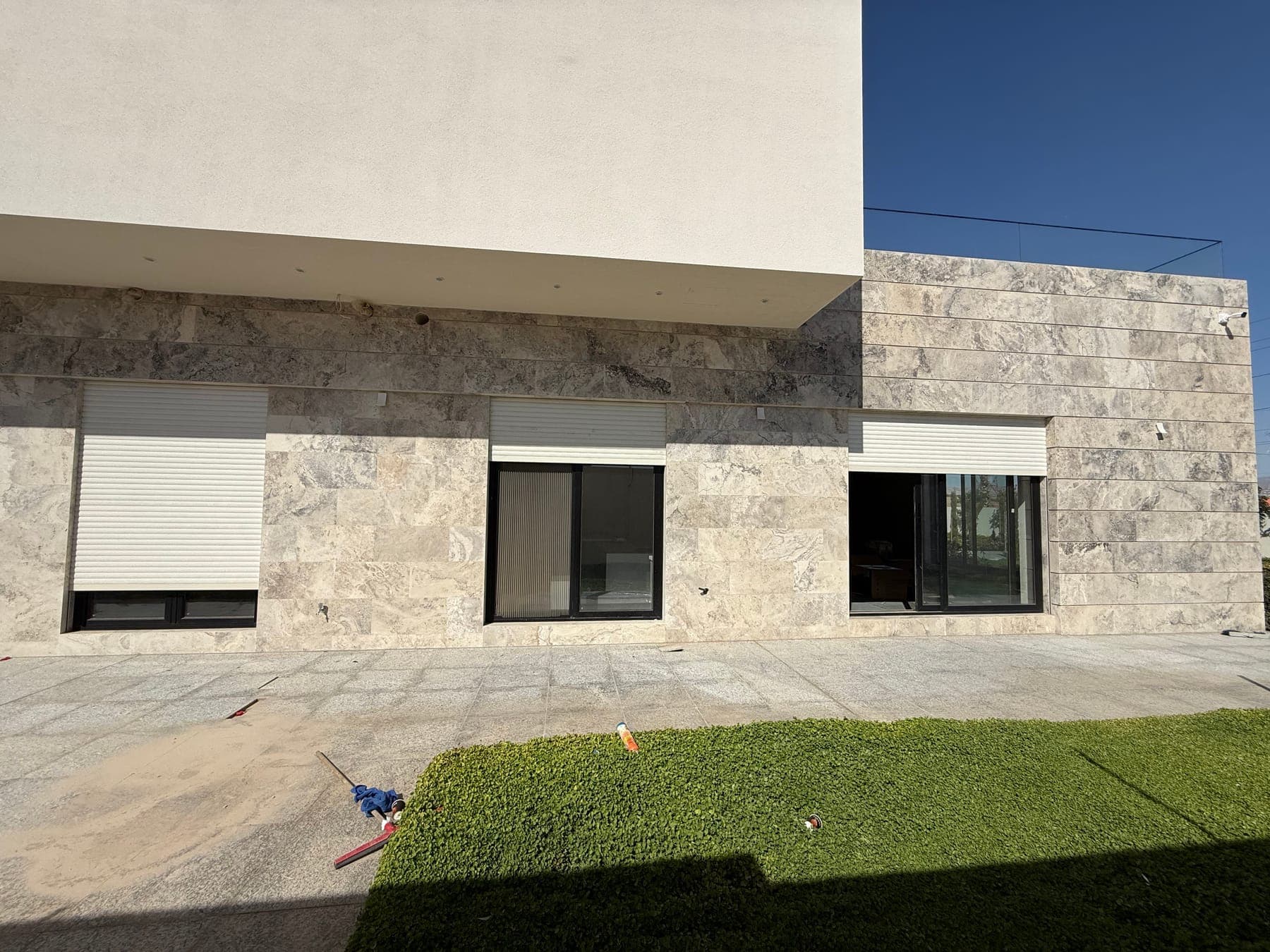 Roller shutters installed over the windows and openings of a building